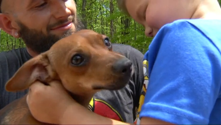 Mason pets Banjo