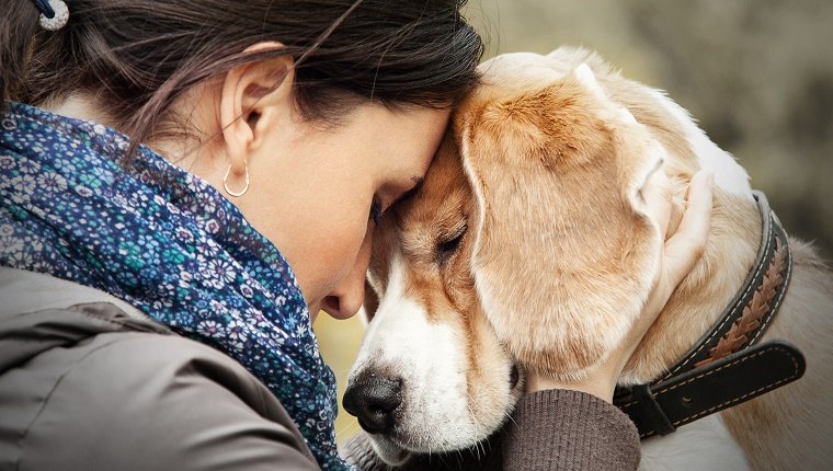 Woman with her dog tender scene