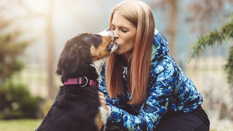 A beautiful young women on a walk with her dog. It’s play time, if you’ll be a good boy you’ll get a treat. A dog is the only thing on earth that loves you more than he loves himself.