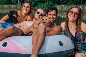 Two Adult Males with Two Adult Females and Two Dogs sitting in a floaty by Ponchatoula Creek after a day of tubing down the river in Southern Louisiana.