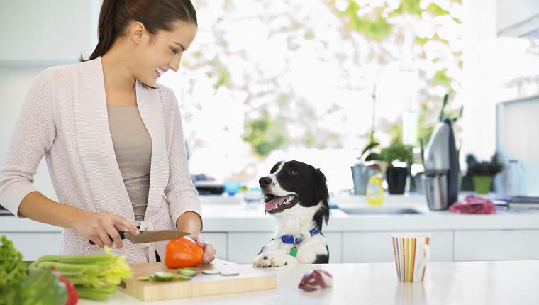 Woman chopping vegetables in kitchen