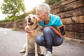 Mature woman jogging with her dog