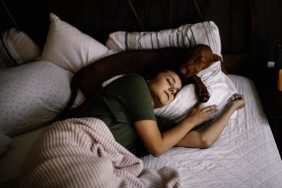 Gorgeous girl and her dog best friend chilling and spending their free time together.