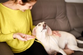 Woman taking supplements.