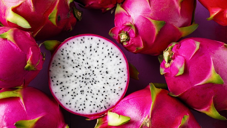 White Dragon Fruit on an old wooden table.