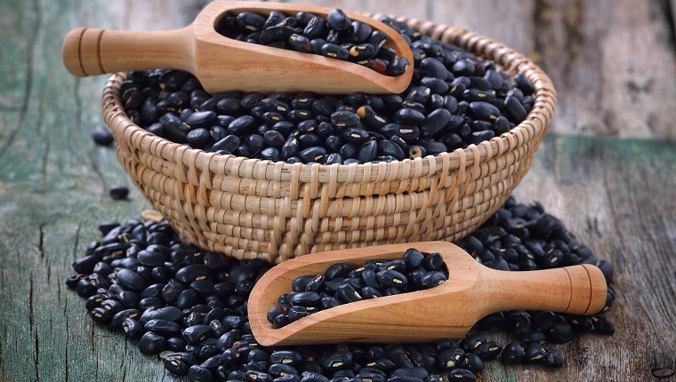 black bean in the spoon on table