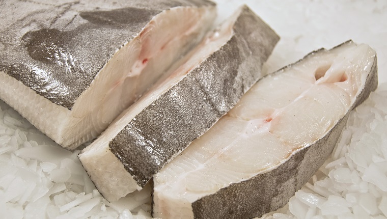 Sliced Halibut fish on ice.