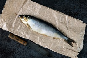 salted herring on a piece of crumpled wrapping paper