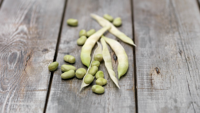 Still life of lima Beans (also known as butter beans) on wooden table