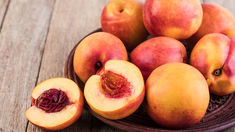 Nectarine fruit on a wooden