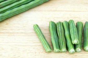 Ciut pieces of Moringa on a cutting board