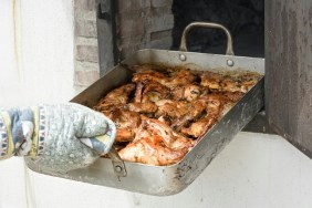 Cropped Hand Of Man With Rabbit Meat