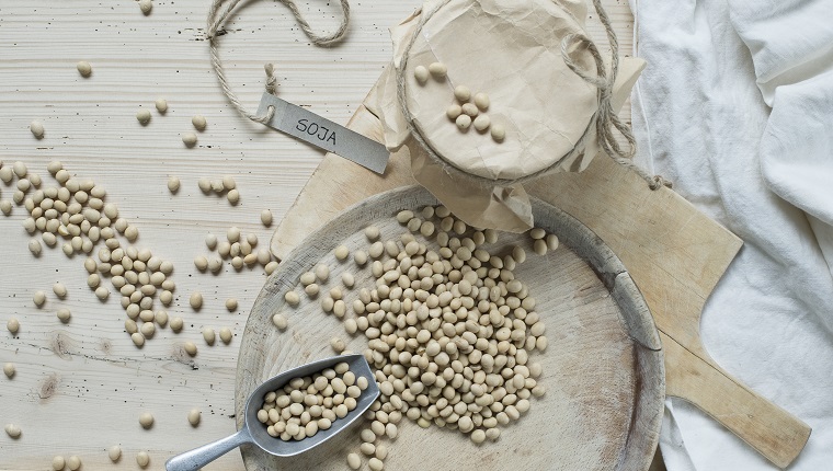 Soy beans on wooden background