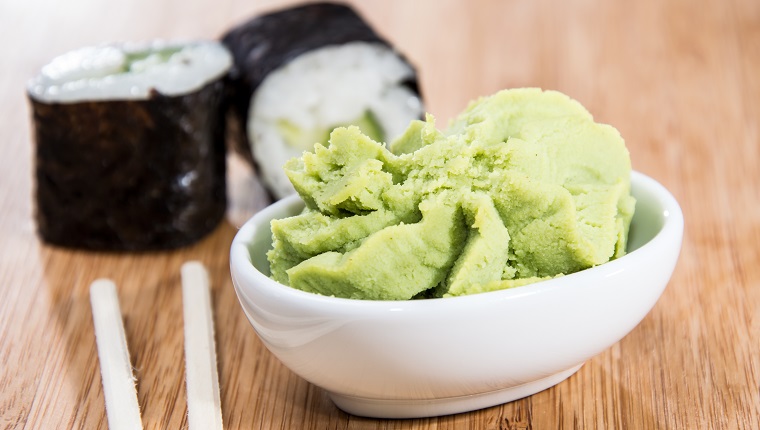 Maki rolls with Wasabi on wooden background