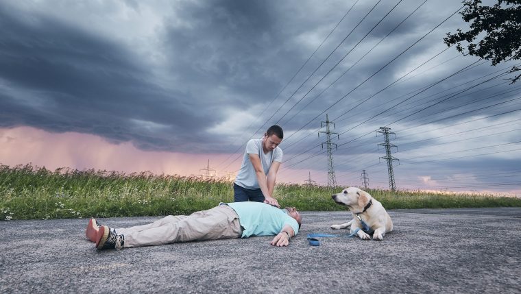 man performing CPR dog saves man's life