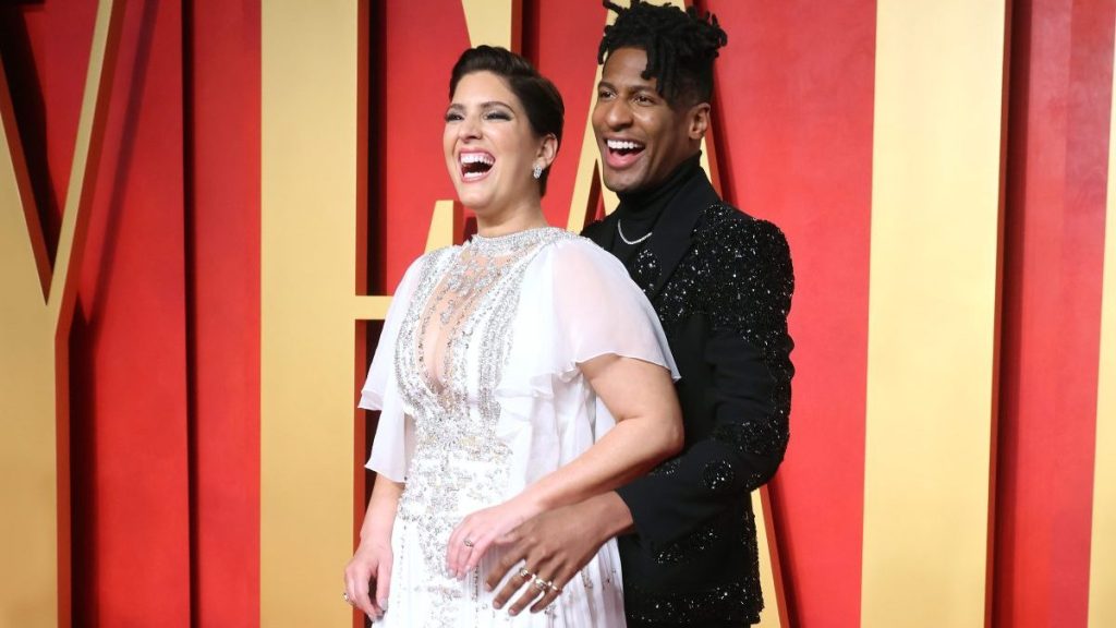 Jon Batiste with wife at Vanity Fair Oscar Party, the couple recently adopted a rescue dog.