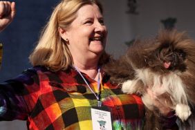 Ann Lewis holds her dog Wild Thang after winning the World's Ugliest Dog contest at the Marin-Sonoma County Fair on June 21, 2024 in Petaluma, California. A Pekingese dog named Wild Thang won the 34th annual World's Ugliest Dog contest and was awarded $5,000.