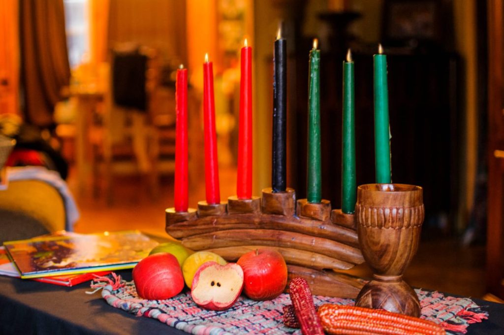 Kinara candles, a potential hazard for dogs during Kwanzaa celebrations.